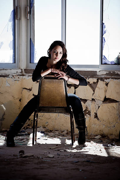istock Young Woman in Chair by Window 153800832