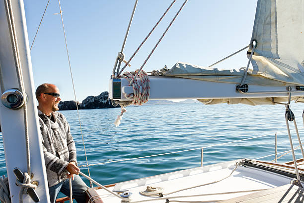 istock Mature Man on Sailboat 153800844