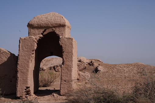 Thatta Sindh, Pakistan - February 04, 2023: Makli Hill Necropolis UNESCO World Heritage Site Picturesque View of a Mausoleum of Isa Khan Tarkhan II on a Sunny Blue Sky Day