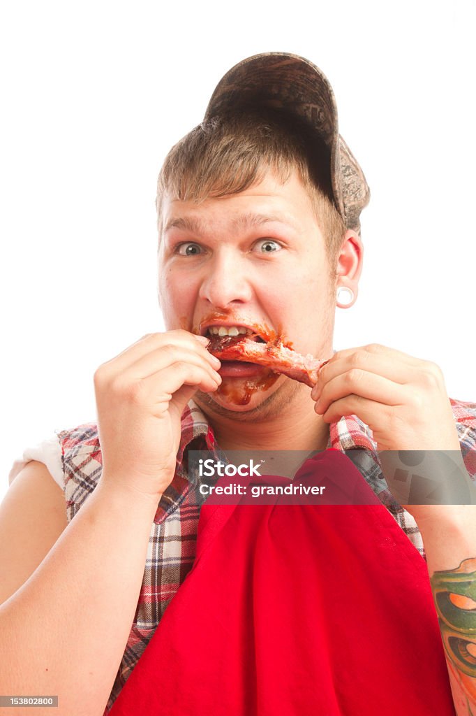 Joven rojo Necks comer costillas de barbacoa - Foto de stock de A cuadros libre de derechos