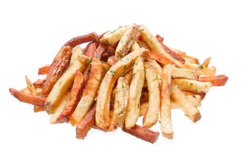 Gourmet Garlic Seasoned French Fries Isolated on white with sea salt