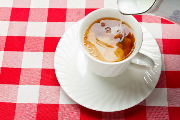 Hot Tea and Milk in a White Teacup
