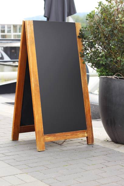 istock Empty menu board on a street, blank sandwich board restaurant or cafe chalkboard. 1538035669