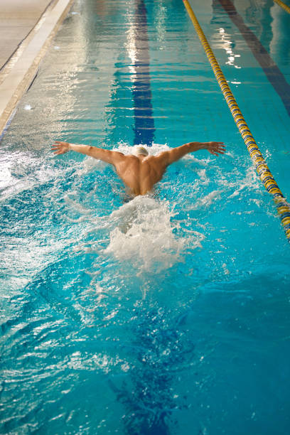 istock Athlete doing workout for recovery in the pool 1538051399