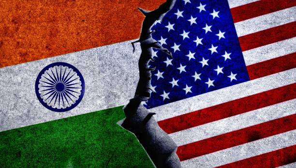 istock USA and India flag together on a cracked wall. 1538057197