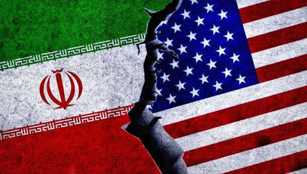 istock USA and Iran flag together on a cracked wall. 1538057415