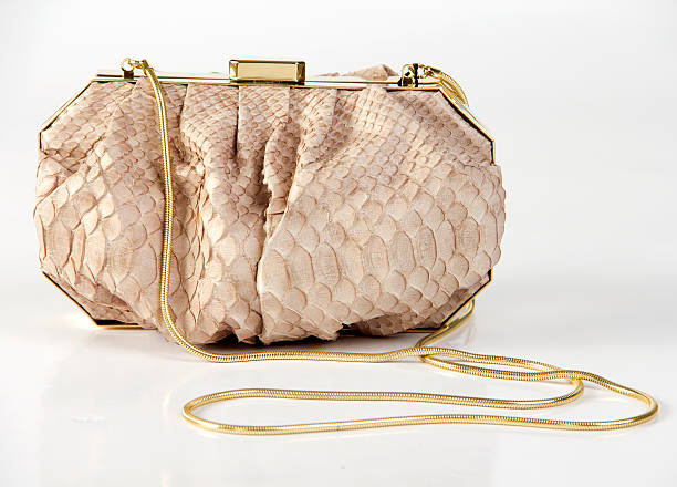 istock Luxury handbag with gold chain isolated on white background 153806570