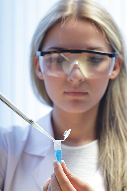 istock beauty scientist in chemical laboratory 153807486