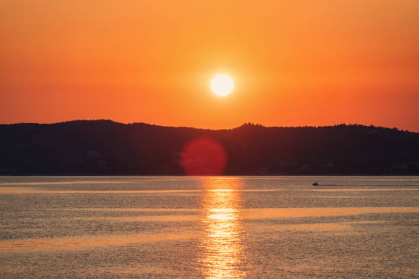 Riding a jet ski at sunset