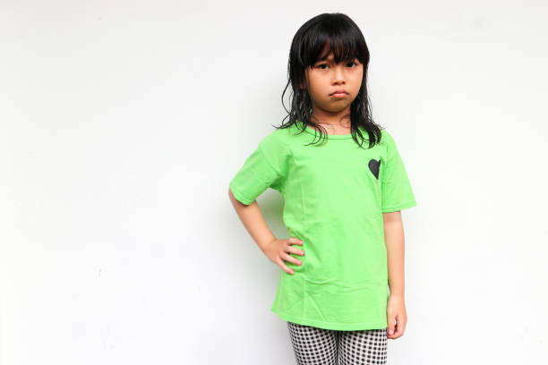 istock A girl with sad face looking at camera while put his hands on the waist. Unhappy feeling concept 1538084152