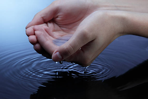 istock woman hand in water 153808443