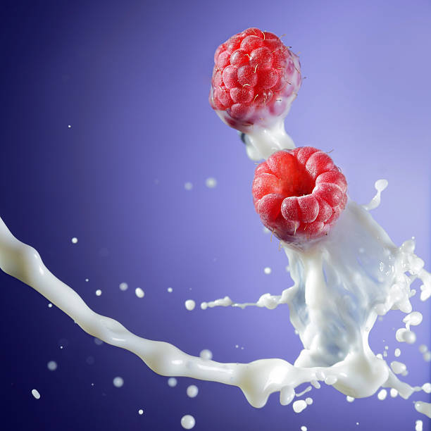 two raspberry in milk stream