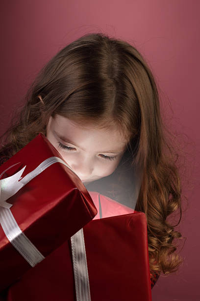 istock litle girl open red gift box 153808578