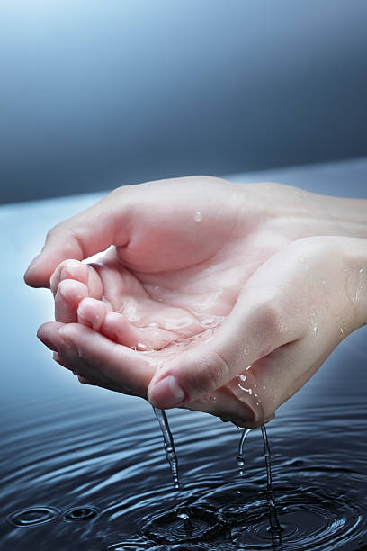 istock woman hand in water 153809738