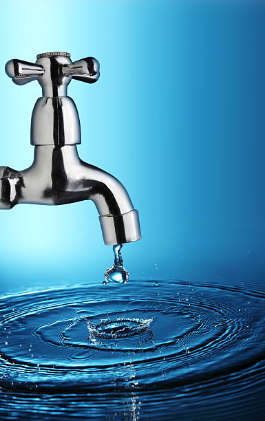 istock water stream from iron faucet 153810588