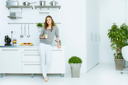 Woman having coffee in her loft