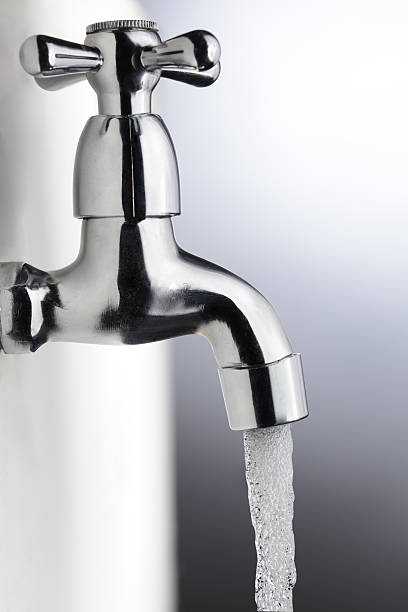 istock water stream from iron faucet 153810782