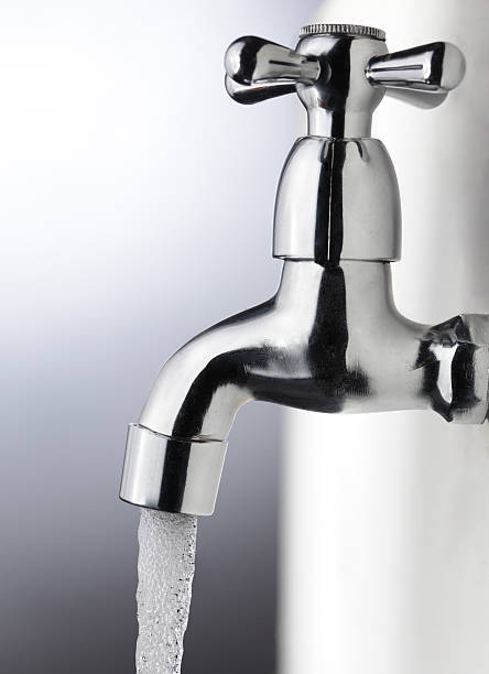 istock water stream from iron faucet 153810807