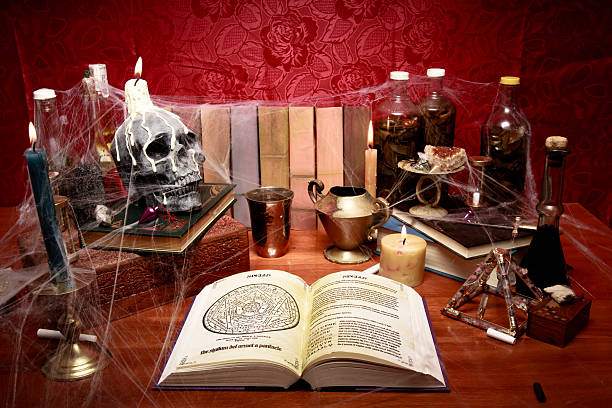 istock Table full of witchcraft related objects and cobwebs 153811485