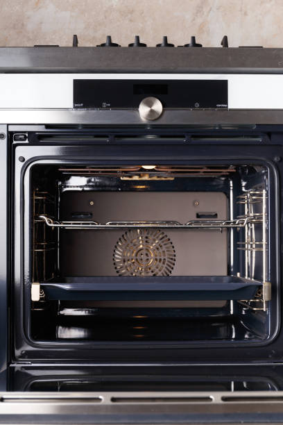 istock Built-in electric oven with open door in the kitchen. 1538114927