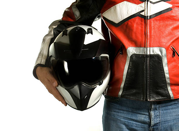 motorrad-bikerjacke mit sturzhelm - motocross jeans denim biker stock-fotos und bilder