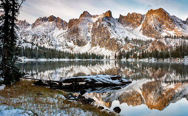 istock Lake reflection of mountains and log winter 153813746