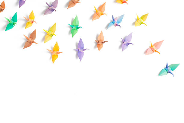 Colorful paper birds Colorful paper birds on white background. origami cranes stock pictures, royalty-free photos & images