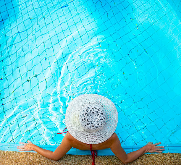 woman relaxing in an outdoor waterpool