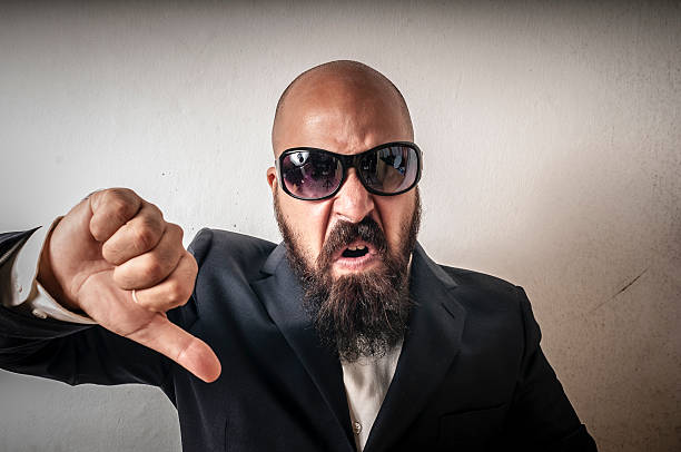 man bouncer with sunglasses and negative expression stock photo