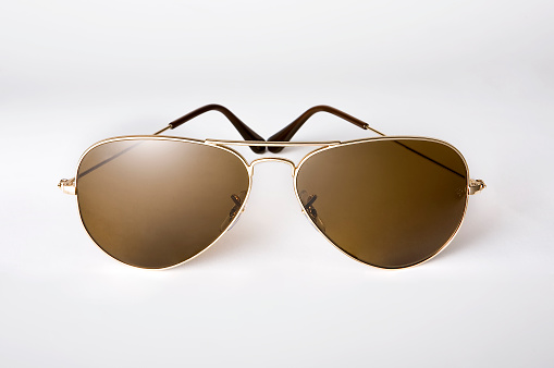 Sunglasses in a metal frame on white background