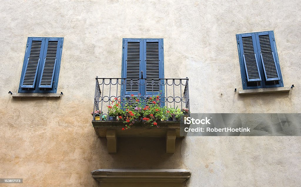 Balcony on house A small balcony on a house, and blue painted shutters at the mediterranean sea. Architecture Stock Photo