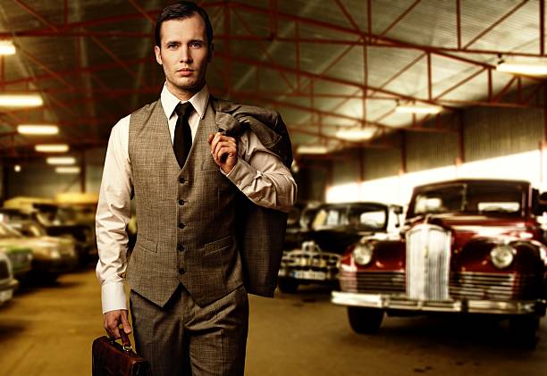 istock Businessman with a briefcase in garage 153817780