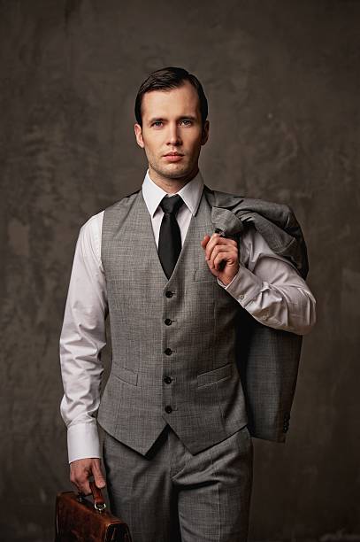 istock Businessman with a briefcase on grey background. 153818030