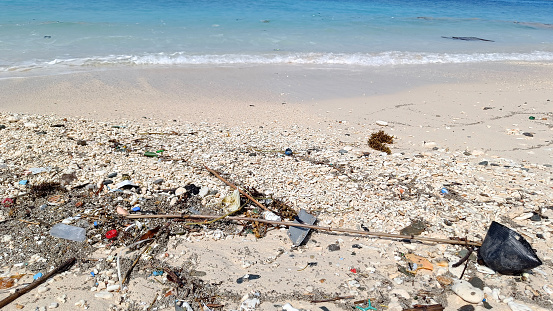 Plastic and other garbage washed up by the ocean on Aharen Beach in Tokashiki Island, Okinawa, Japan.