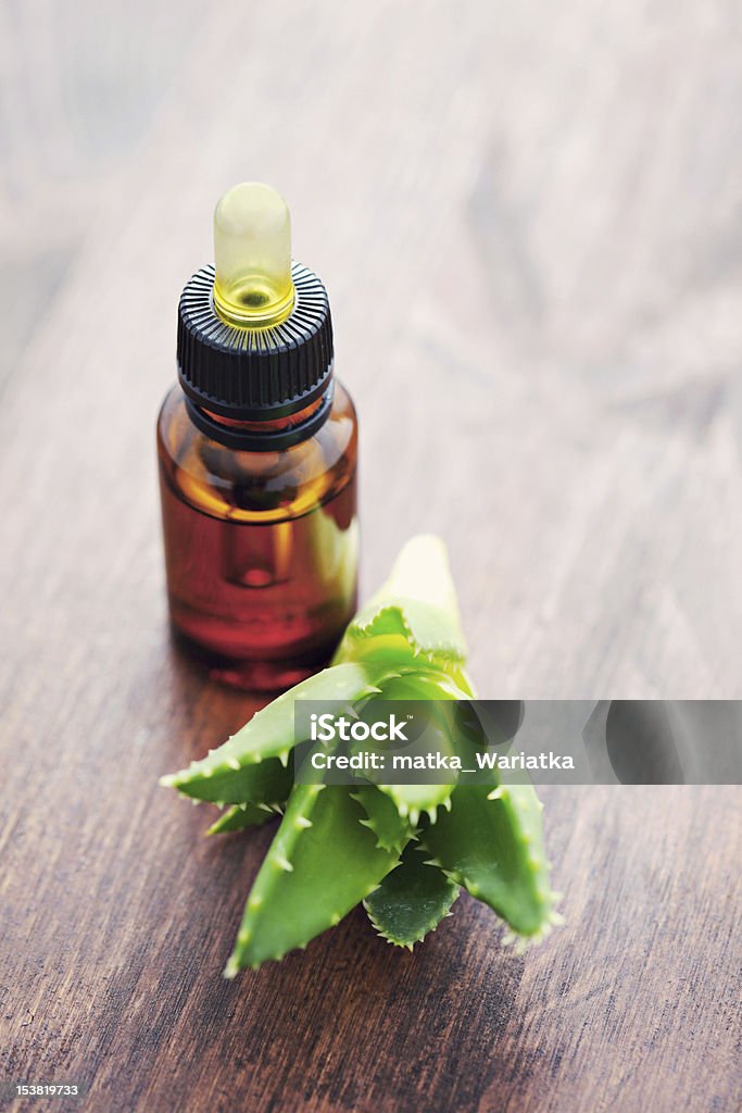 aloe essential oil bottle of aloe vera essential oil - beauty treatment Aloe Stock Photo