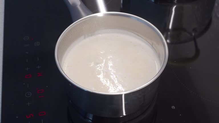 cooking corn milk porridge on an electric stove