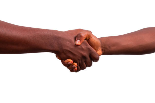 Handshake between two African people, hands isolated on white background