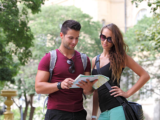 istock Young couple watching the city map 153823695