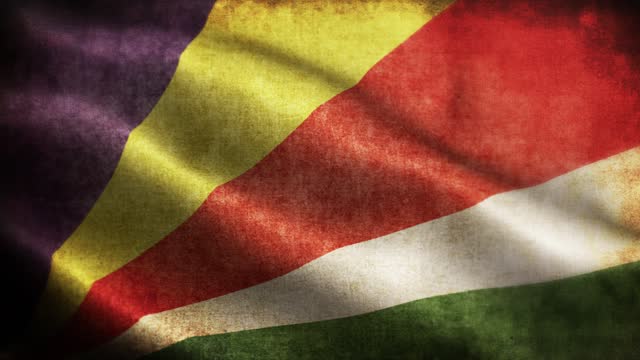Closeup of grunge Seychelles waving flag loopable stock video