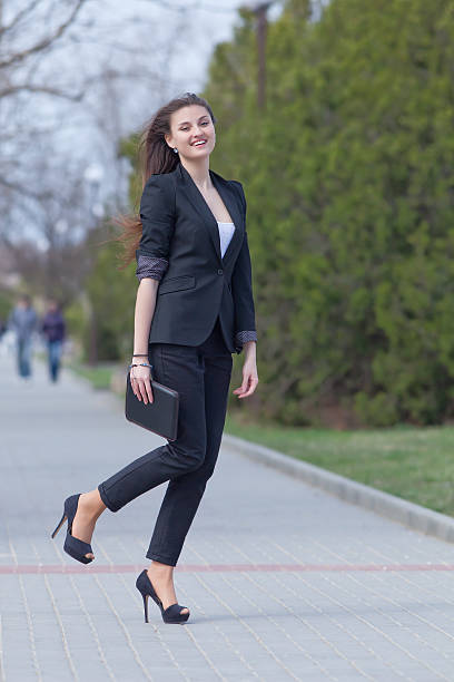 istock Brunette on stiletto heels in the park 153823731