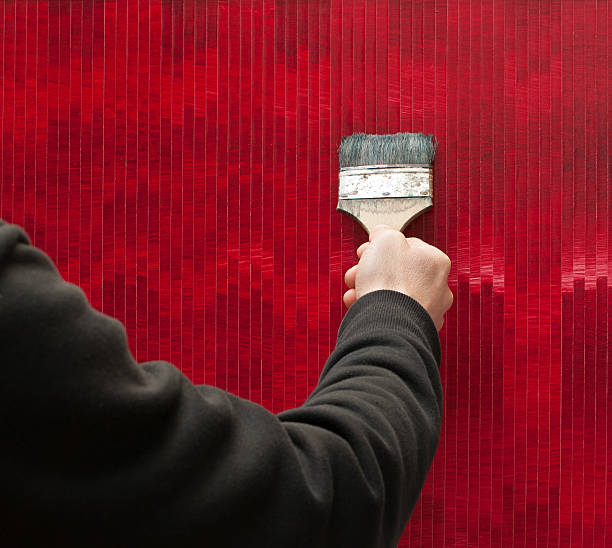 istock artist hand and red painting 153824035