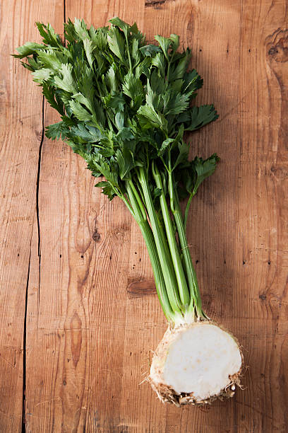 Celery on a wooden table stock photo