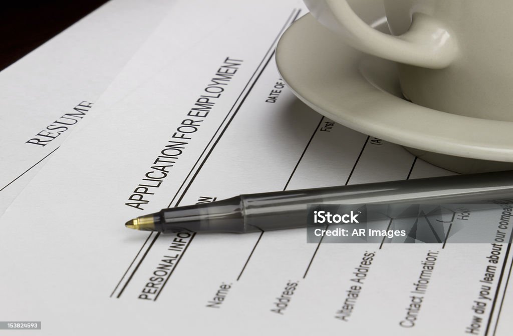 Job application Blank employment application with resume, pen and coffee on desk. Application Form Stock Photo