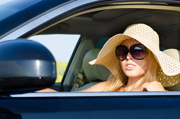 istock Woman driver in sunhat and sunglasses 153824859