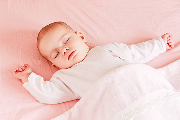 istock Sleeping baby girl 153825470