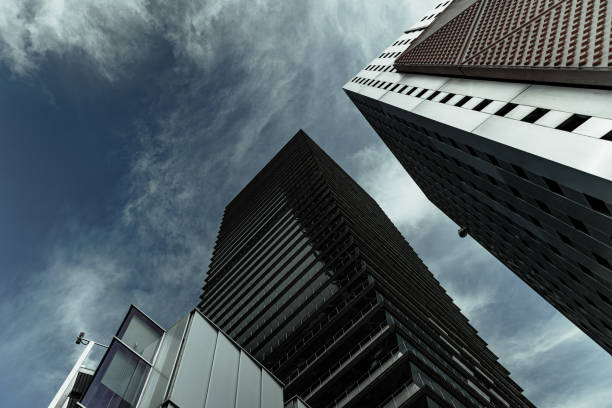 istock From below geometric skyscraper with angled edges and mirrored walls in Barcelona Spain 1538266425