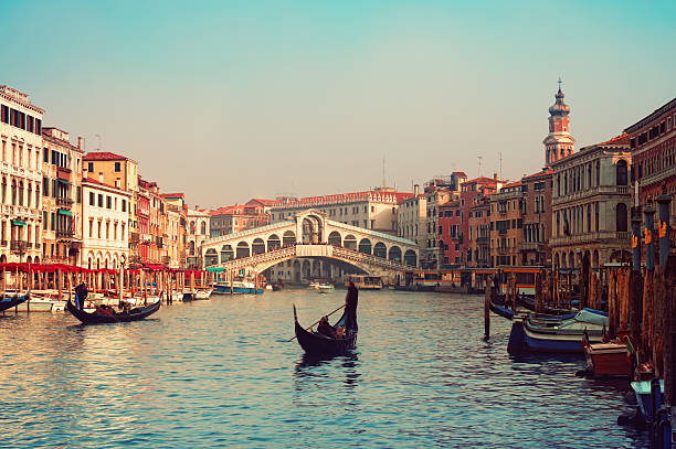 Rialto Bridge, Venice - Italy Rialto Bridge and gondolas  in Venice. venice italy stock pictures, royalty-free photos & images