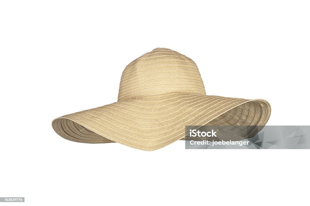 A straw large-rimmed beach hat on a white background A straw beach sun hat isolated on white Sun Hat Stock Photo