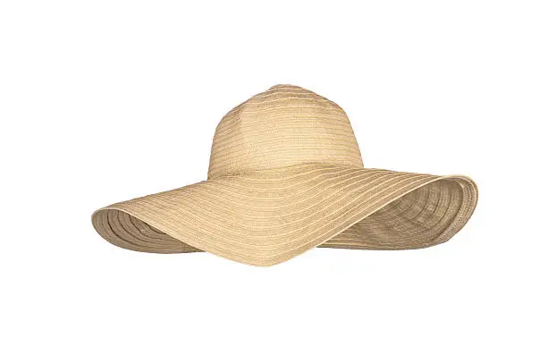 Photo of A straw large-rimmed beach hat on a white background