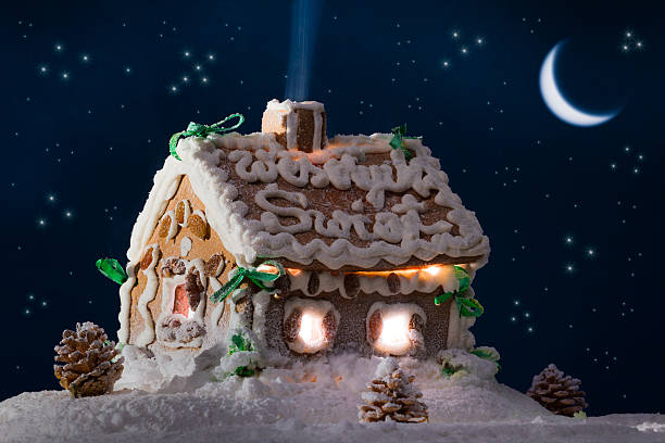 istock Snowy gingerbread cottage with stars and moon 153829995